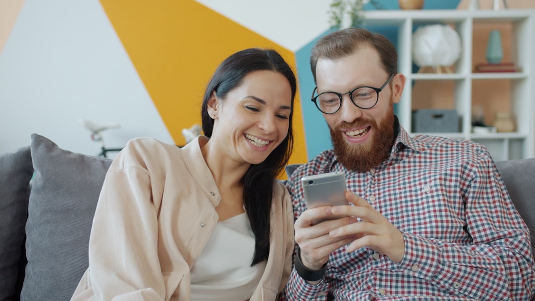 Happy couple looking at a phone together