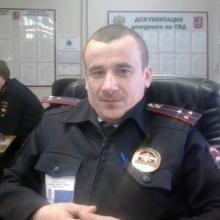 николай