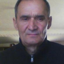николай