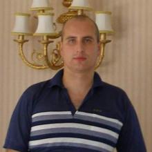 николай