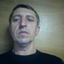 николай