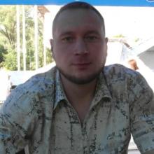 николай