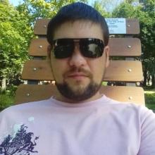 николай