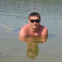 николай